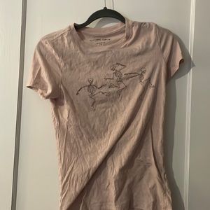 Light pink Aeropostale graphic tee with roller blading skeletons